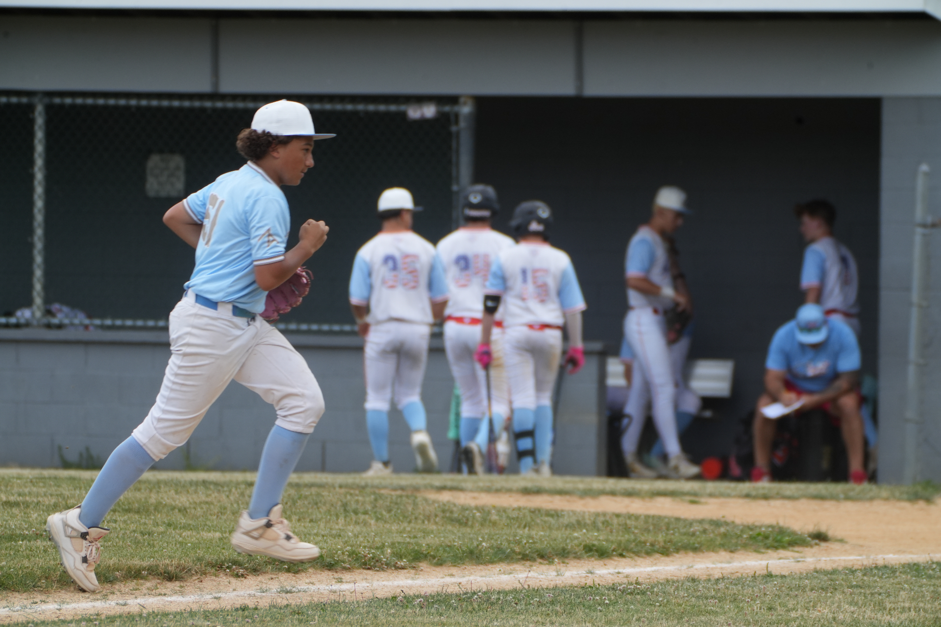 Player running off the field toward the dugout