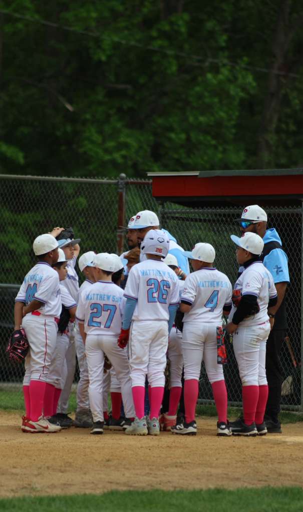 Team in pink socks gathered before the game